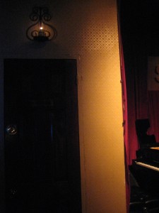 Smoke restroom door adjacent to the stage
